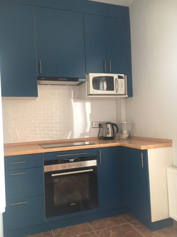 design of a small dark blue kitchen