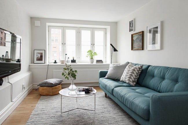 design of a small living room with a straight sofa