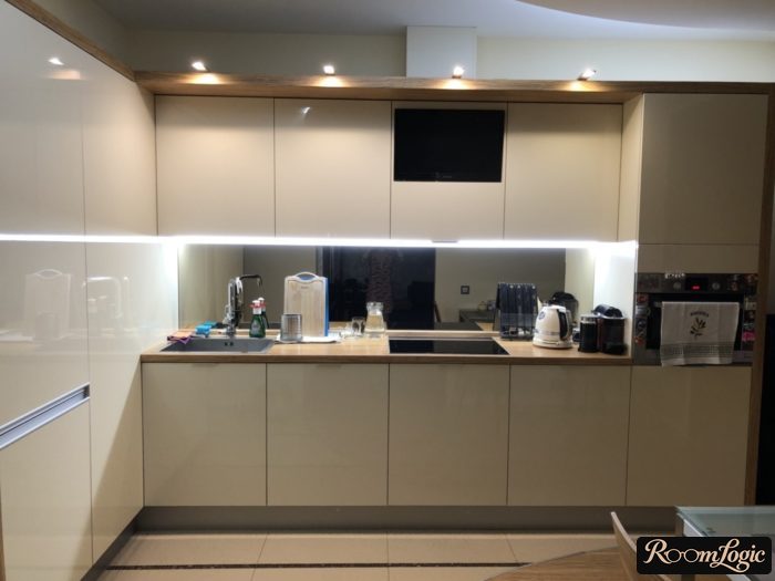 design of a white glossy kitchen 110 square feet