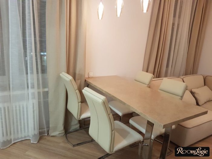 dining table in the middle of the kitchen-living room