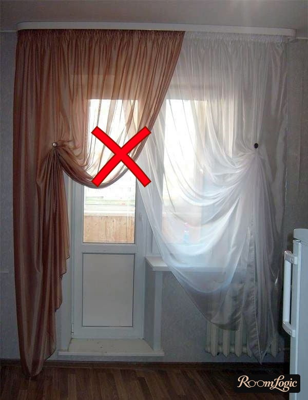 drapes tied back in the kitchen with a balcony