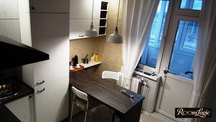 drapes with tiebacks next to the heater in the kitchen with a balcony