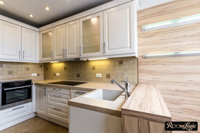 U-shaped kitchen with an island sink
