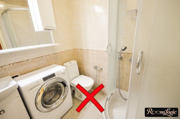 Economy-class bathroom with a shower, washer, and floor-mounted toilet
