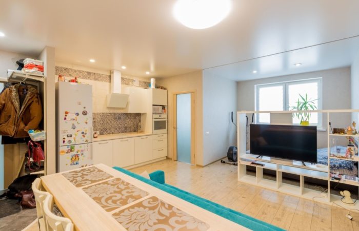 entryway combined with living room and kitchen