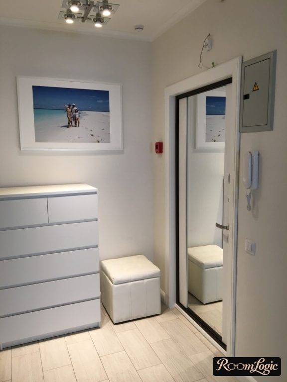 entryway door with full-length mirror in compact hallway