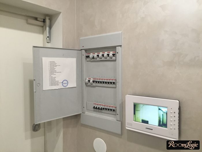 entryway with a box containing intercoms and video intercom on the wall