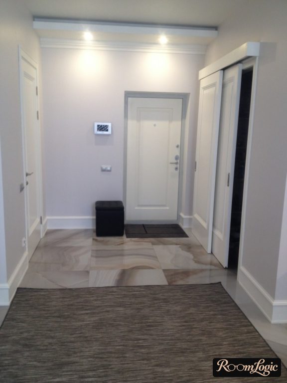 entryway with large square tile on the floor