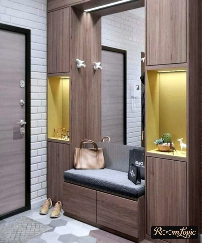 entryway with niche featuring mirror and bench