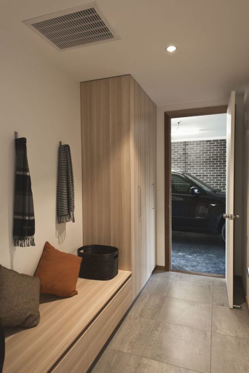 entryway with varying height closets