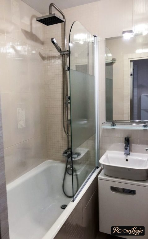 foldable glass curtain for the bathtub in a tiny apartment
