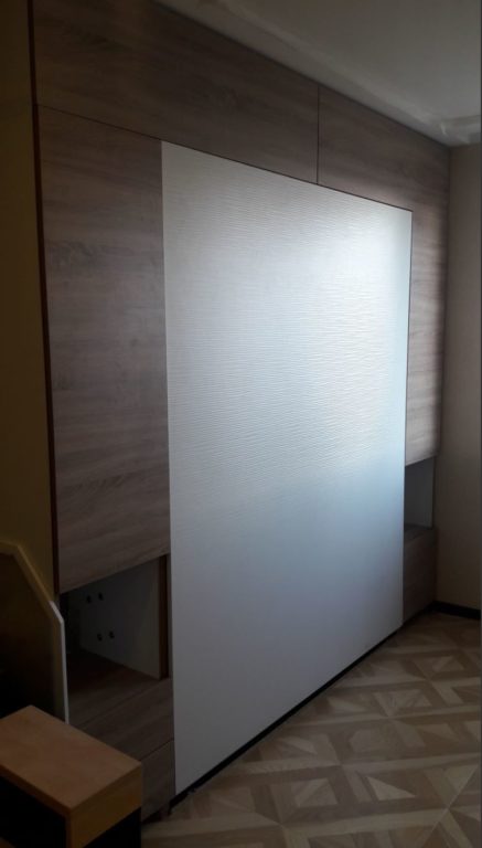 folding bed from the wall in one-bedroom apartment