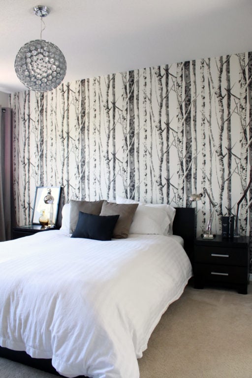 Forest scene behind a bed