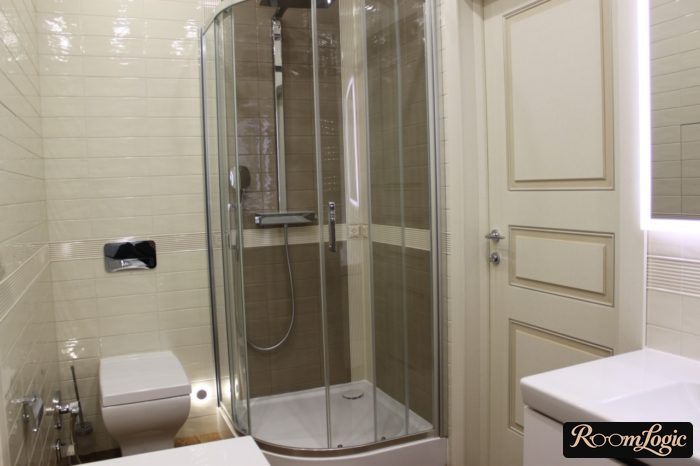 glass shower niche with a tray in the bathroom
