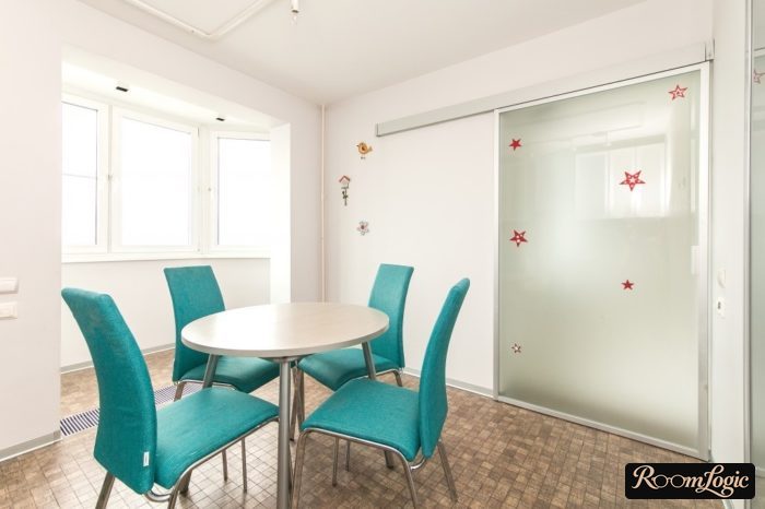 glass sliding door between kitchen and living room
