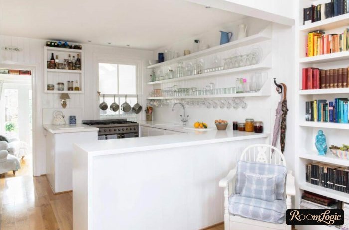 Glass wine glasses on open shelves in the kitchen