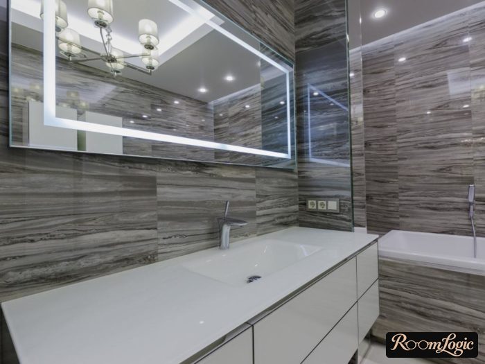 Glossy gray tile on the bathroom walls