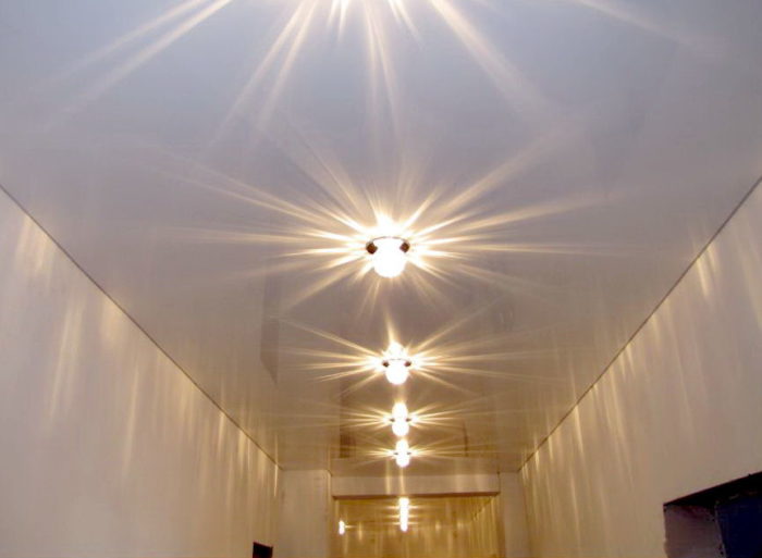 Glossy stretch ceiling in the entryway