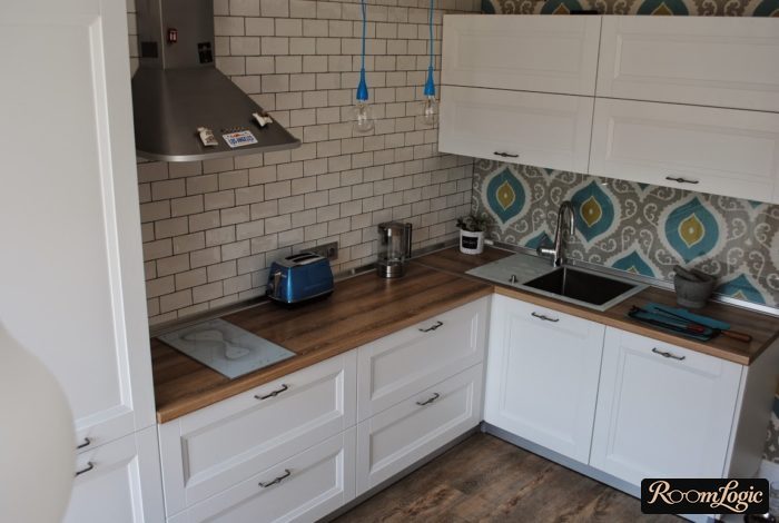 Glossy white brick on the kitchen in a Scandinavian style with loft elements