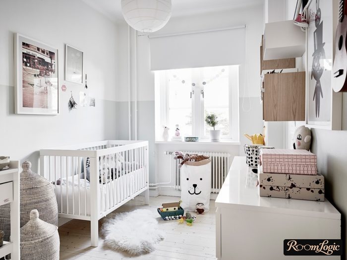 Glossy white furniture in a preschool boy's room