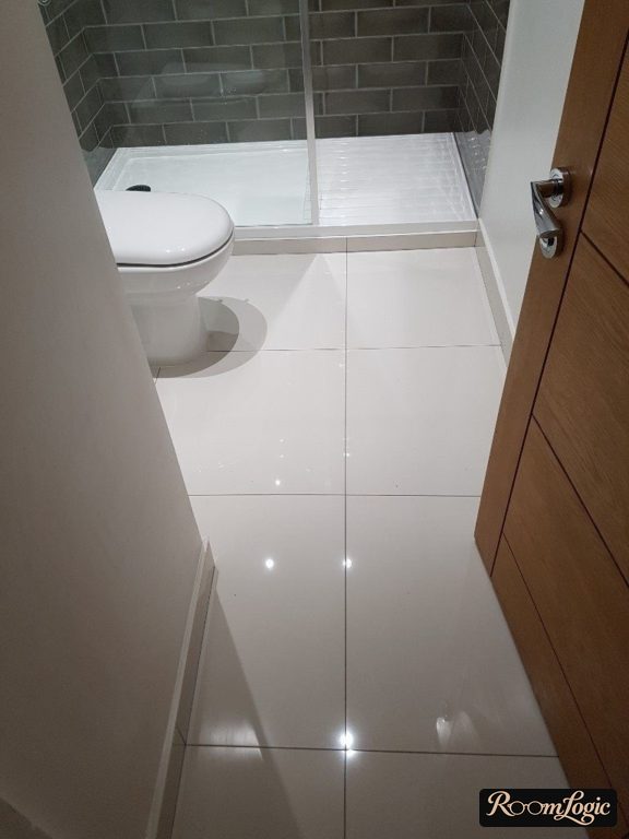 Glossy white square tile 60x60 on bathroom floor