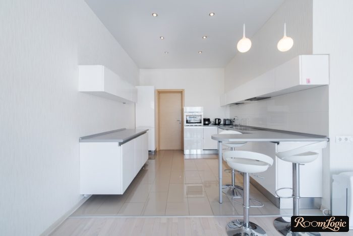 Glossy white tile for kitchen floor with gray grout