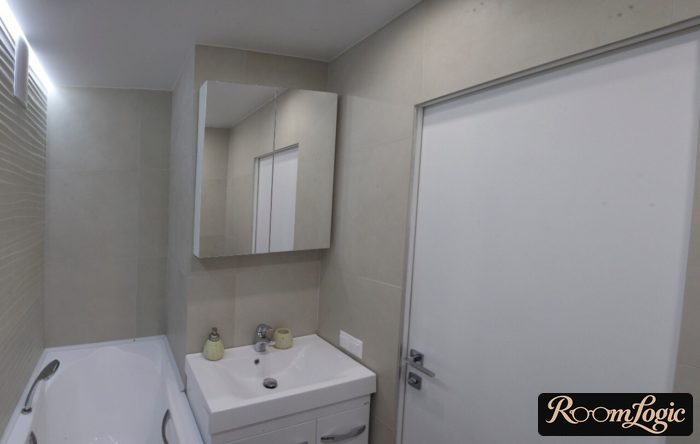 gray bathroom in a tiny apartment