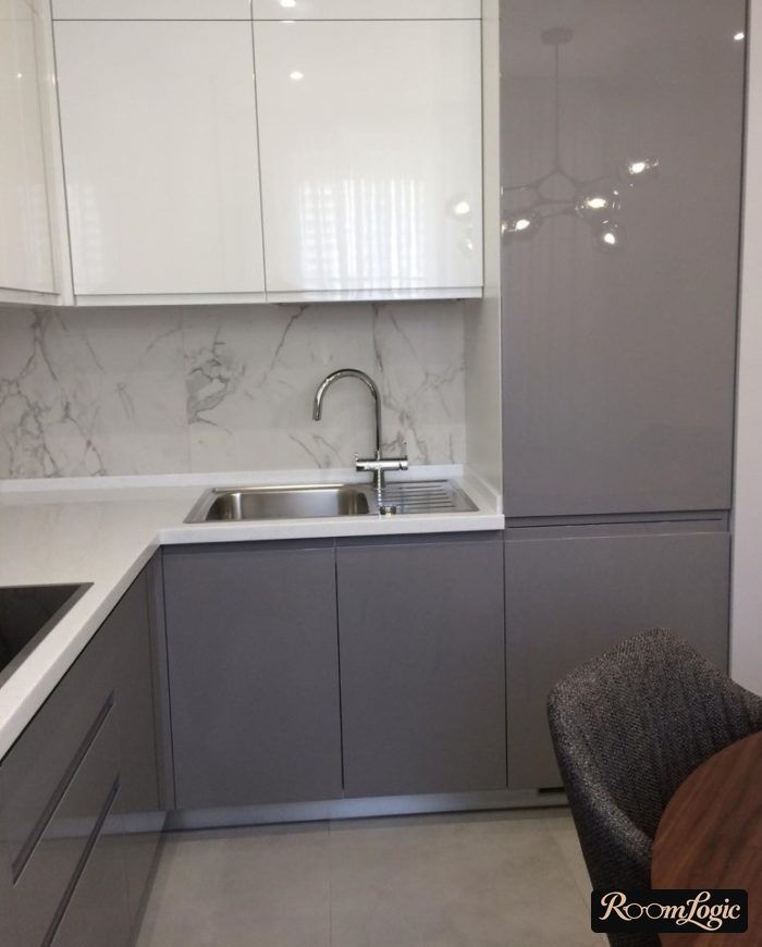 gray corner kitchen with built-in refrigerator
