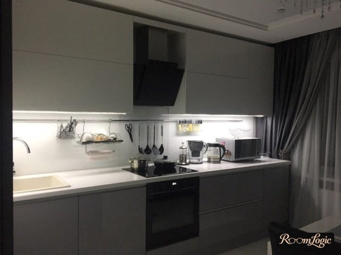 gray curtains with poles on a white kitchen with a balcony