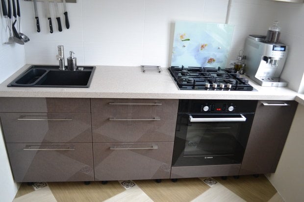 gray glossy cabinet fronts in a tiny apartment