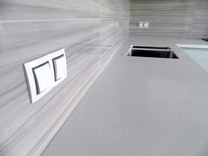 gray glossy tile on the kitchen backsplash