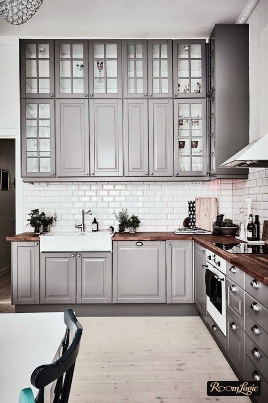 gray kitchen in neoclassical style up to the ceiling