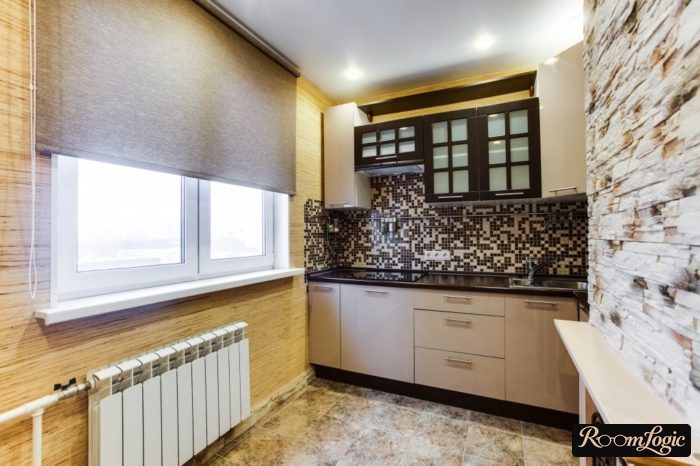 gray linen roller shades on a small kitchen