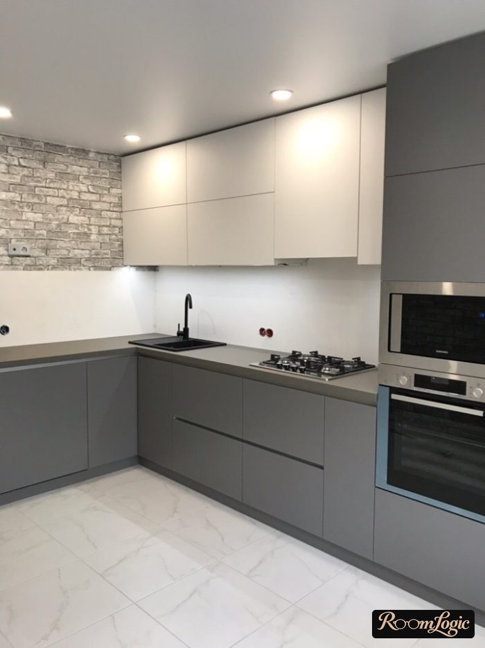 gray modern corner kitchen without upper cabinets on one side
