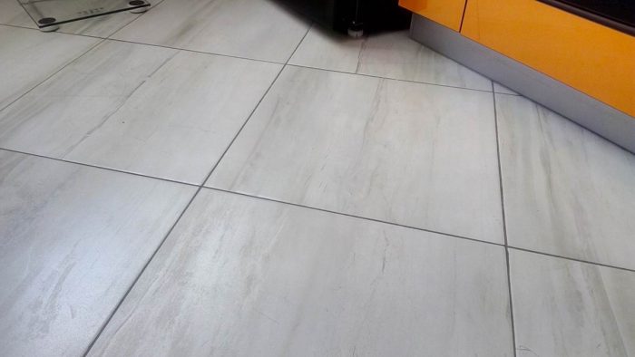 gray porcelain tile on the floor in the kitchen