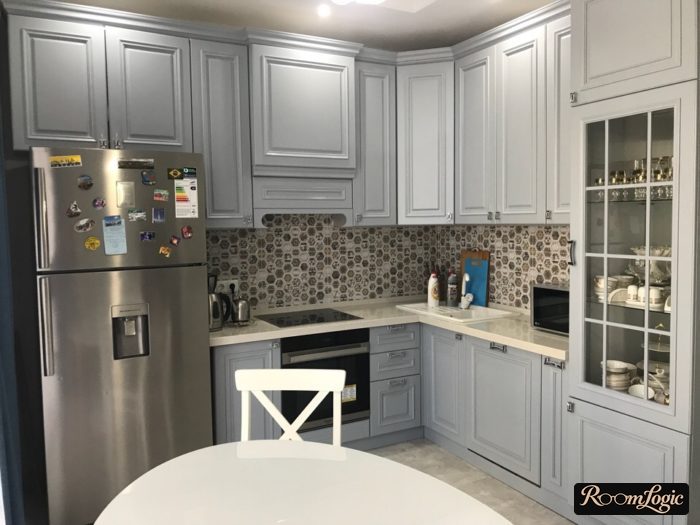 gray refrigerator in kitchen interior