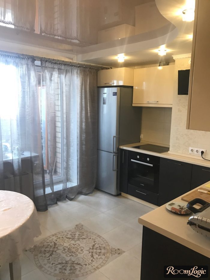 gray sheer curtain on a wall mount in the kitchen with a balcony