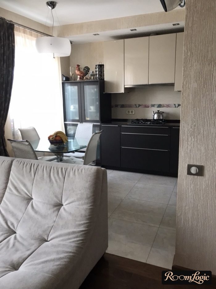 gray square tile with concrete imitation on the kitchen