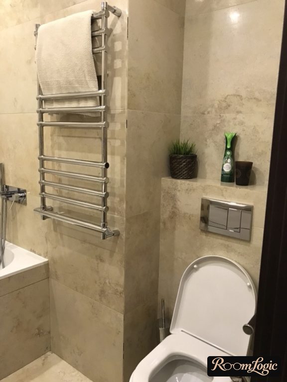 gray tile in the interior of a combined bathroom