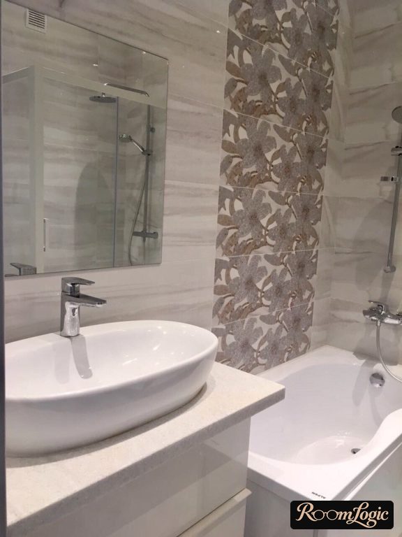 gray tile with colors in small bathroom