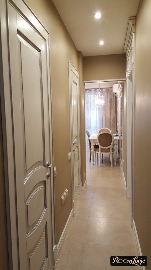 hallway in a classical style apartment with brown walls