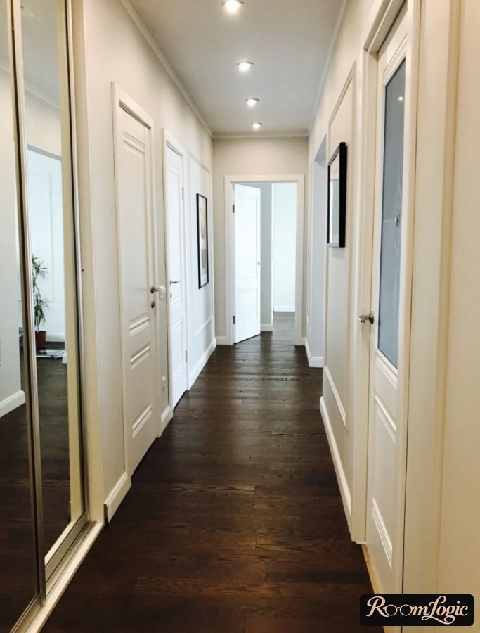 hallway with a large number of doors