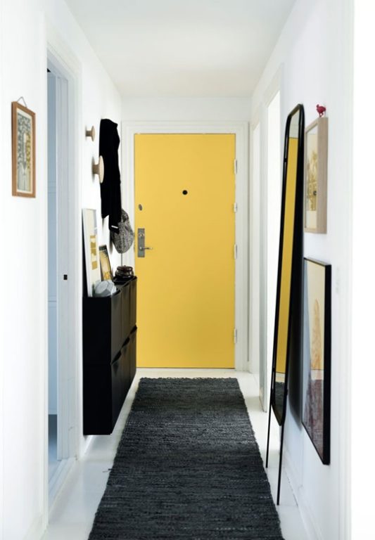 Hallway with a narrow wall-mounted cabinet