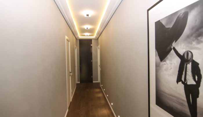 hallway with light fixtures in the floor