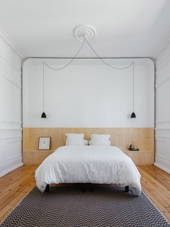 Hanging lights on both sides of the bed