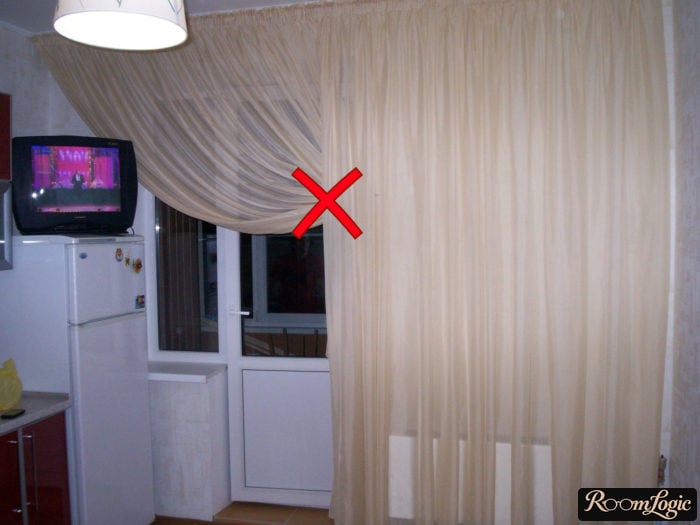 High curtain rod above the balcony door in the kitchen