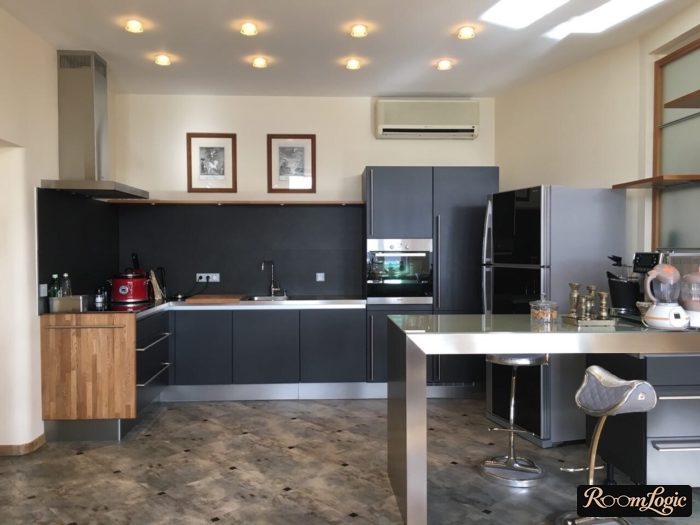 high-tech kitchen without upper cabinets