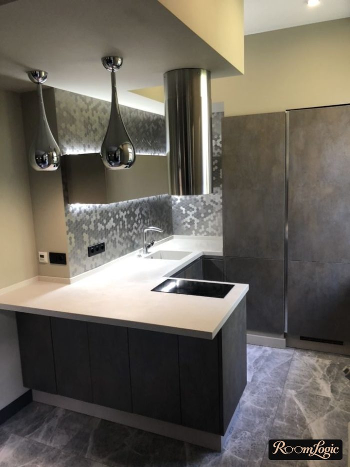 high tech style kitchen with suspended light fixture