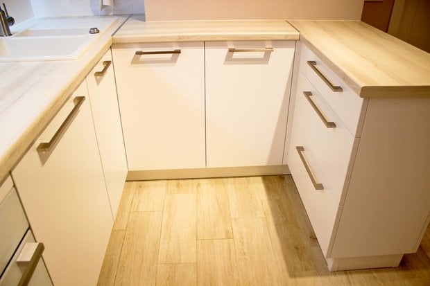 hinged doors at the corner of the kitchen