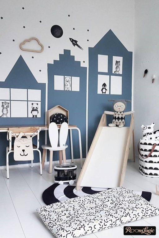house-shaped wallpaper and a slide in the boy's room